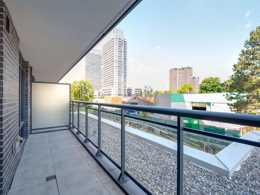 a view of the city from the balcony of a condo