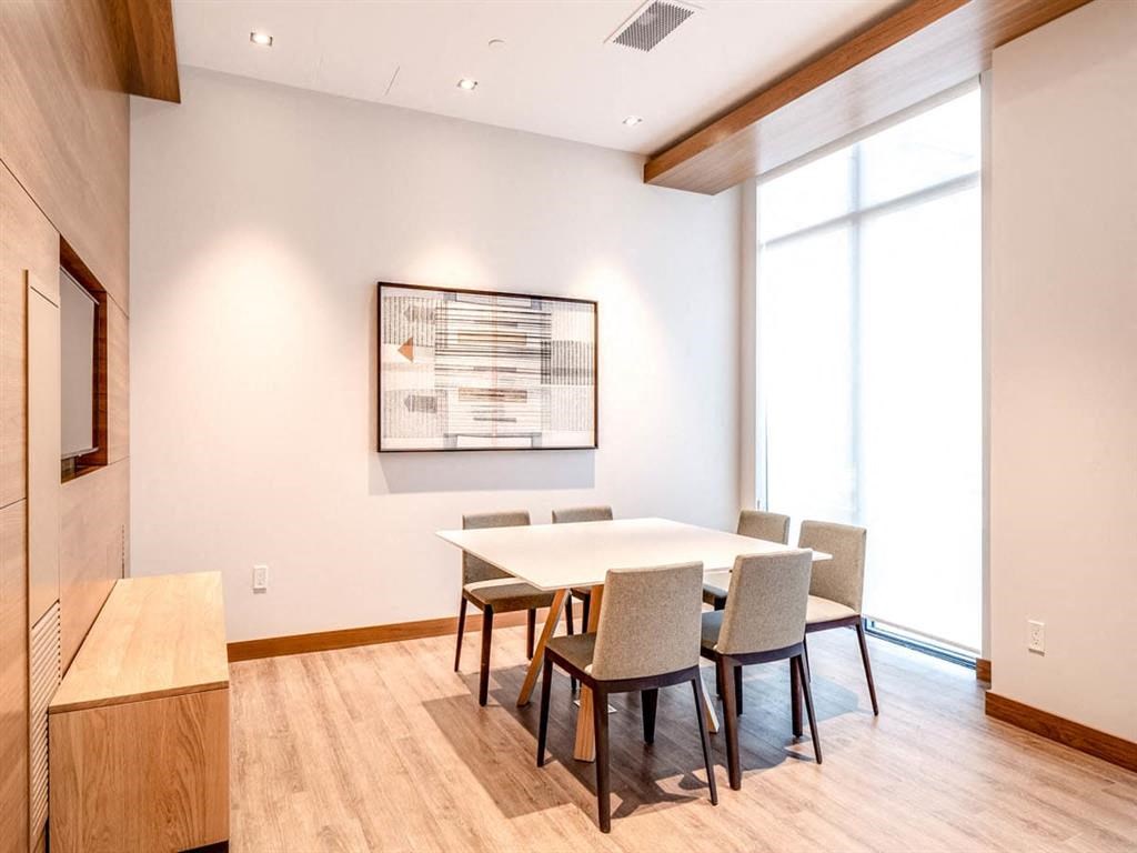 a conference room with a table and chairs