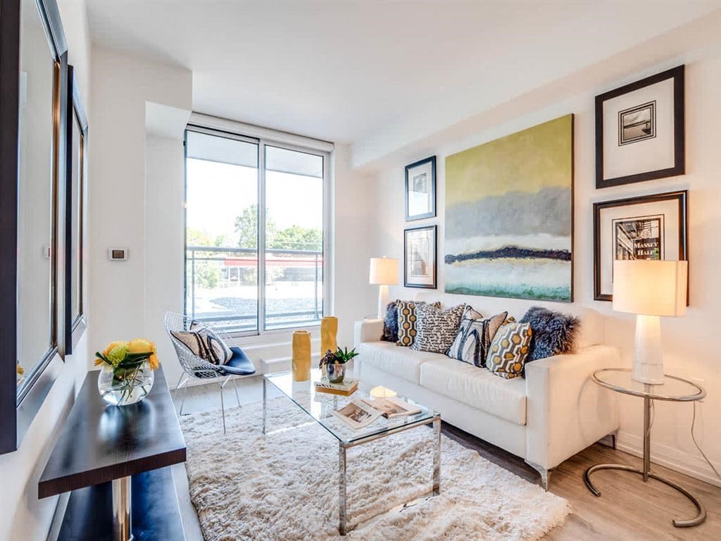 a living room with a couch and a glass table