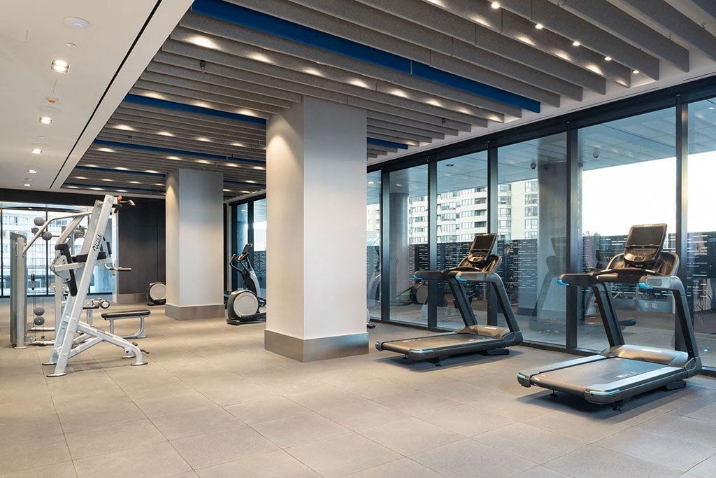 a gym with a view of the city