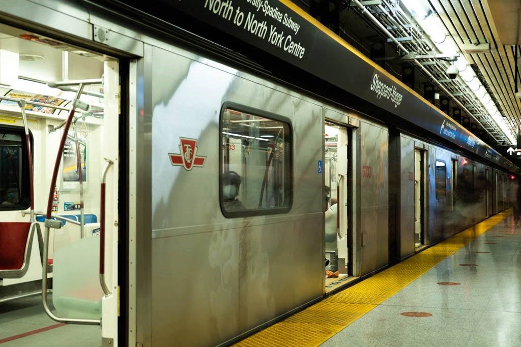 a subway train stopped at a subway station
