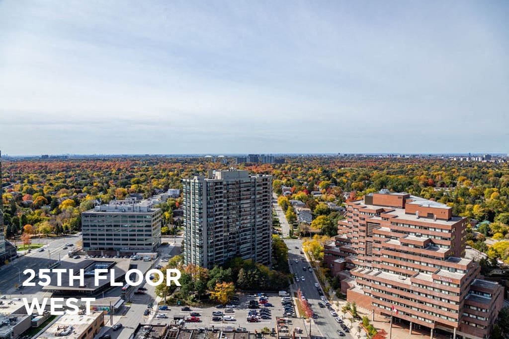an aerial view of a city with tall buildings