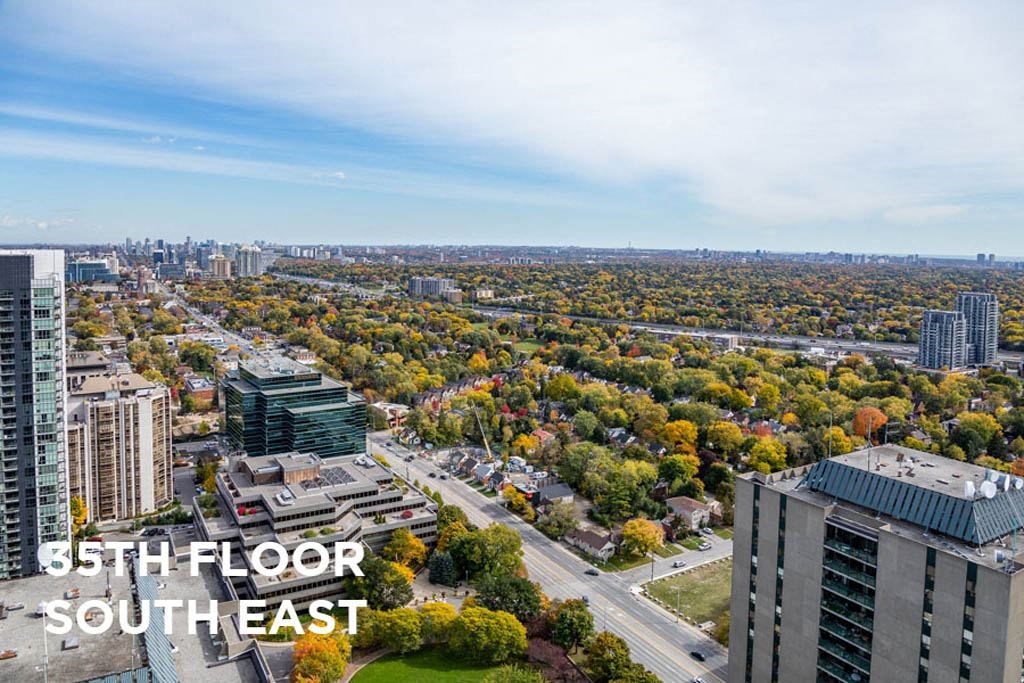 an aerial view of the city with trees and buildings