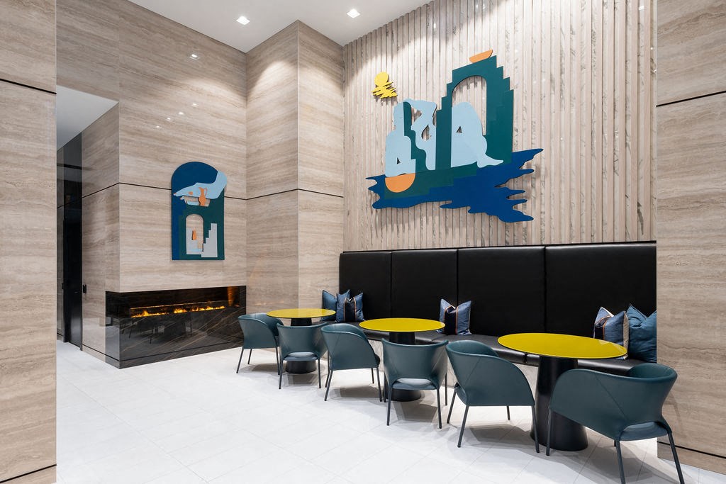 the fountains in the lobby of a building with chairs