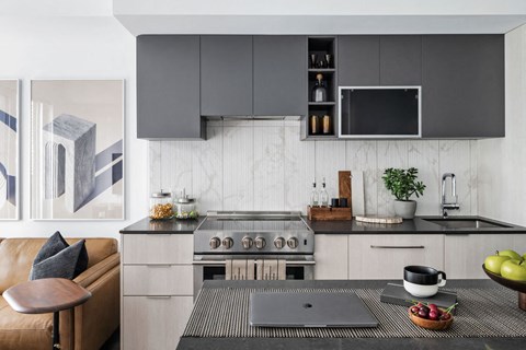 a kitchen with stainless steel appliances and a table