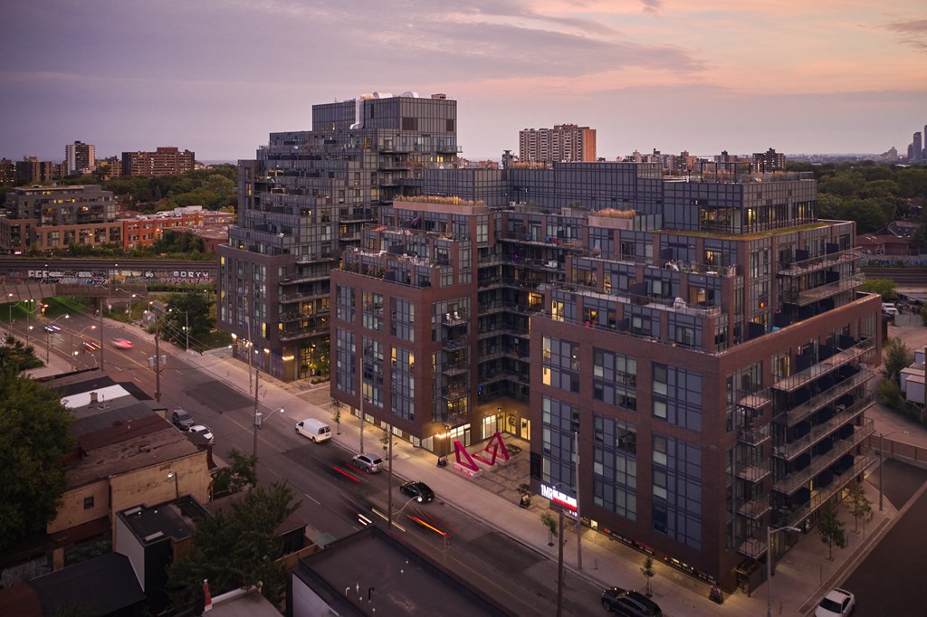 an aerial view of a city street at dusk