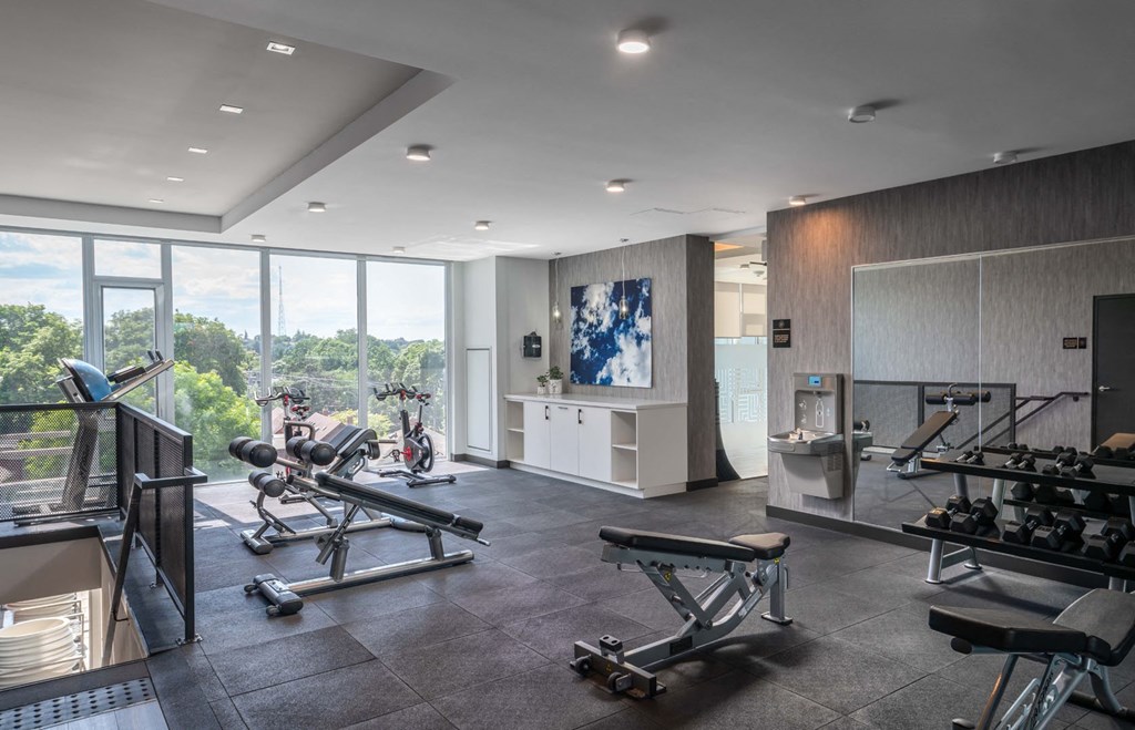a gym with a view of the city