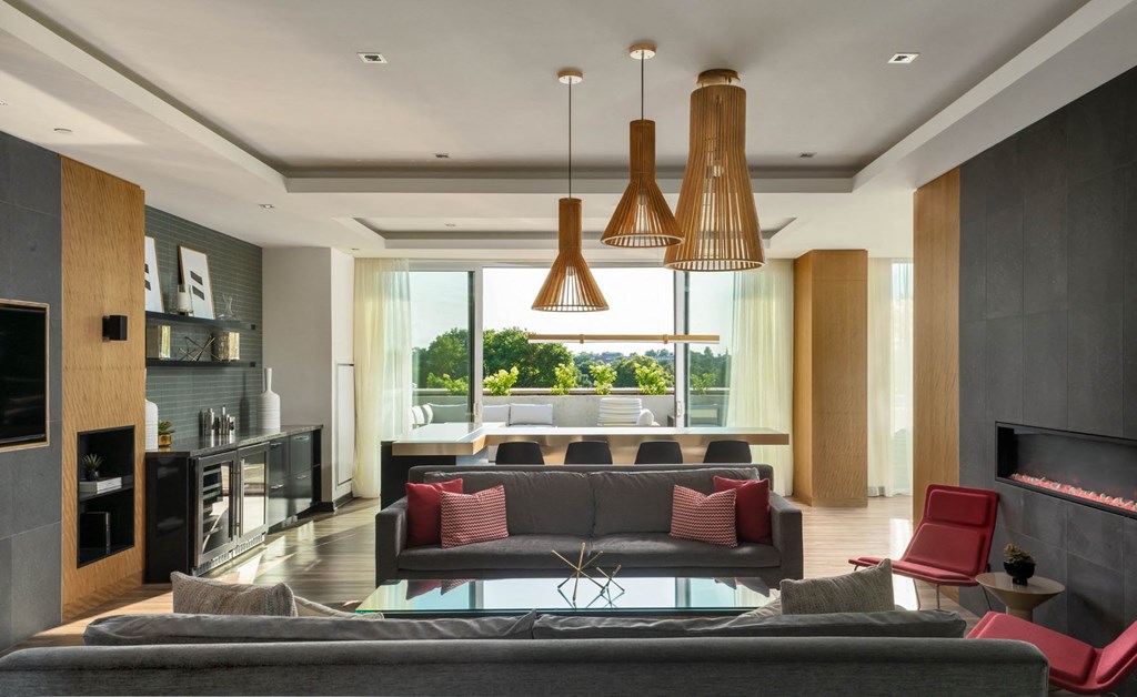 a living room with a couch and a table with chairs