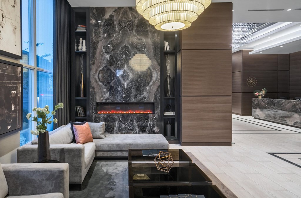 a living room with a fireplace and a couch and a coffee table