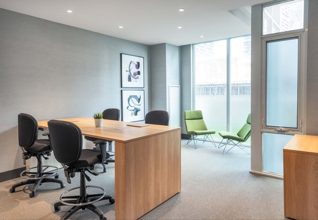 a conference room with a table and chairs