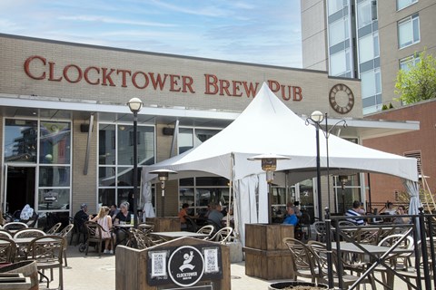 The Clocktower Brew Pub has a large white tent set up outside.