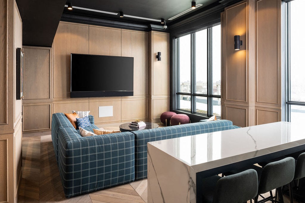 a living room with a couch and a table and a television