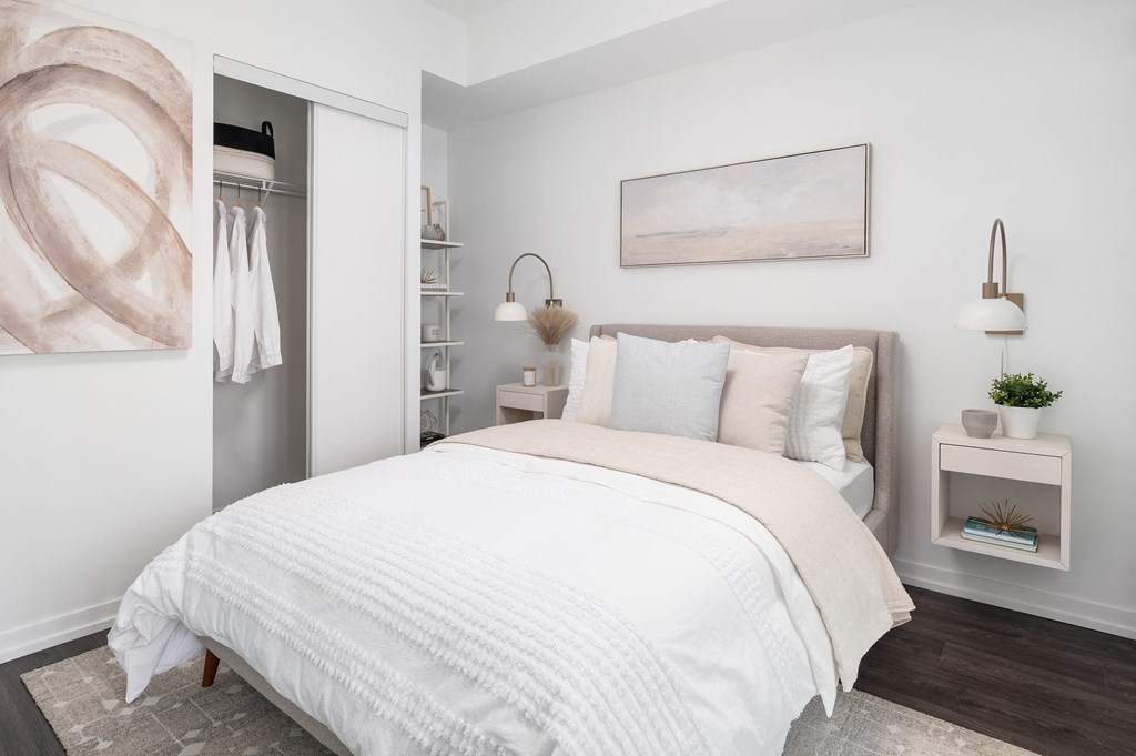 a bedroom with a bed and a closet