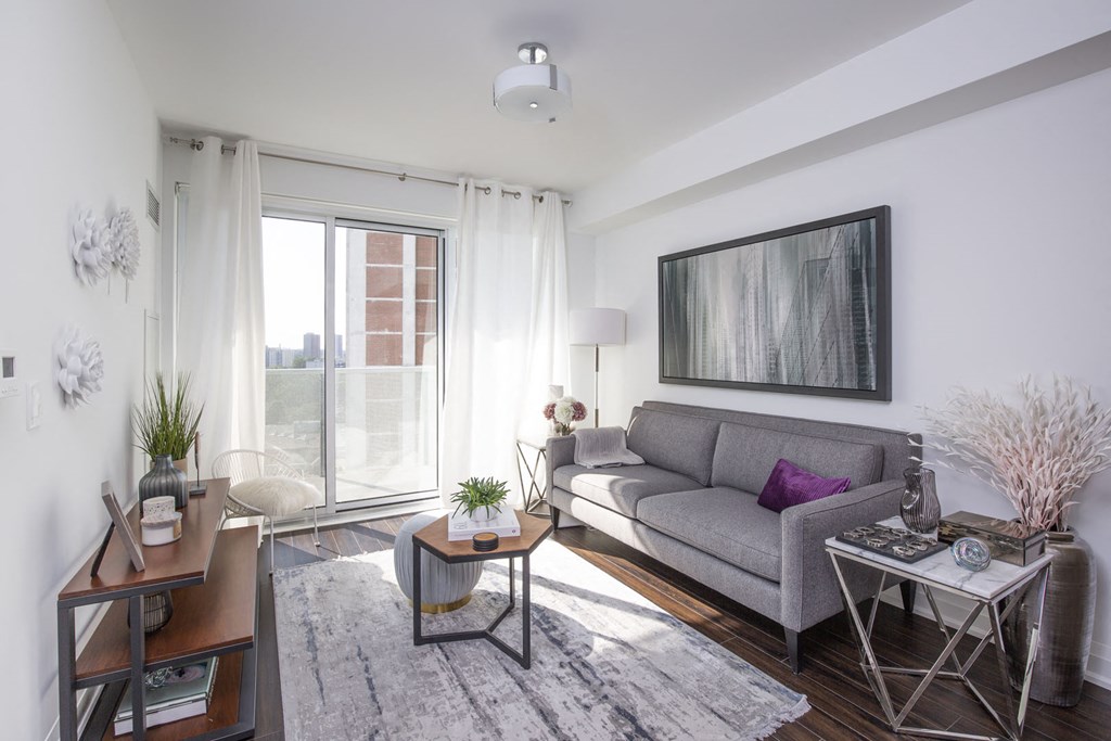 a living room with a couch and a large window