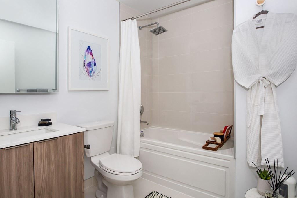 a small bathroom with a shower and a toilet and a sink