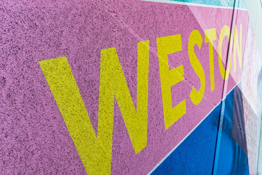 a sign on the side of a bus with the word vans on it