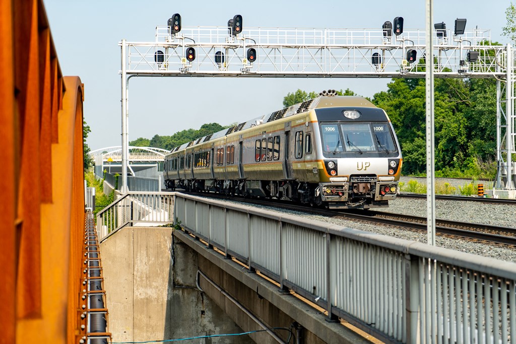 a train on the tracks on a bridge