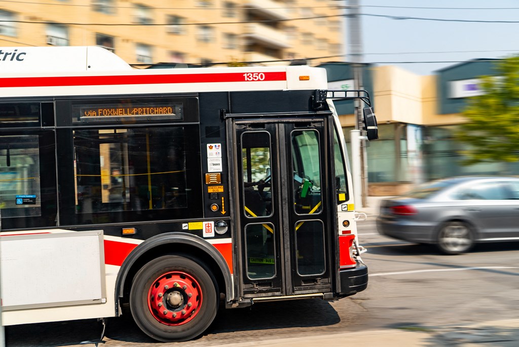 a city bus driving down a city street