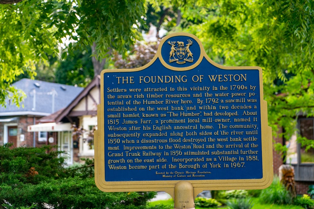 a sign in front of a house stating the finding of wisdom