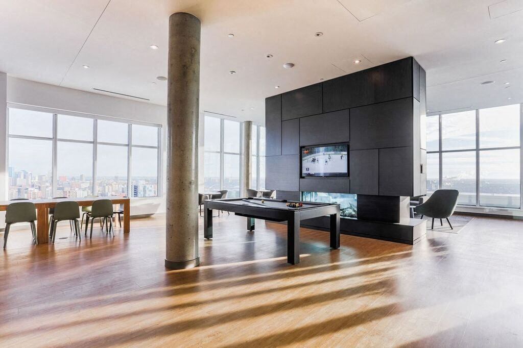 a living room with a table and a television