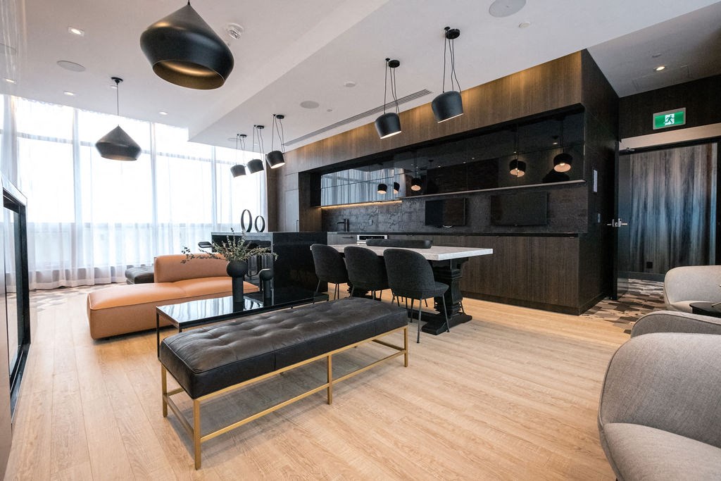 a large living room with a kitchen and a couch