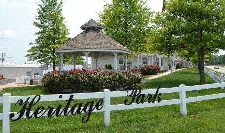 a white fence in front of a gazebo