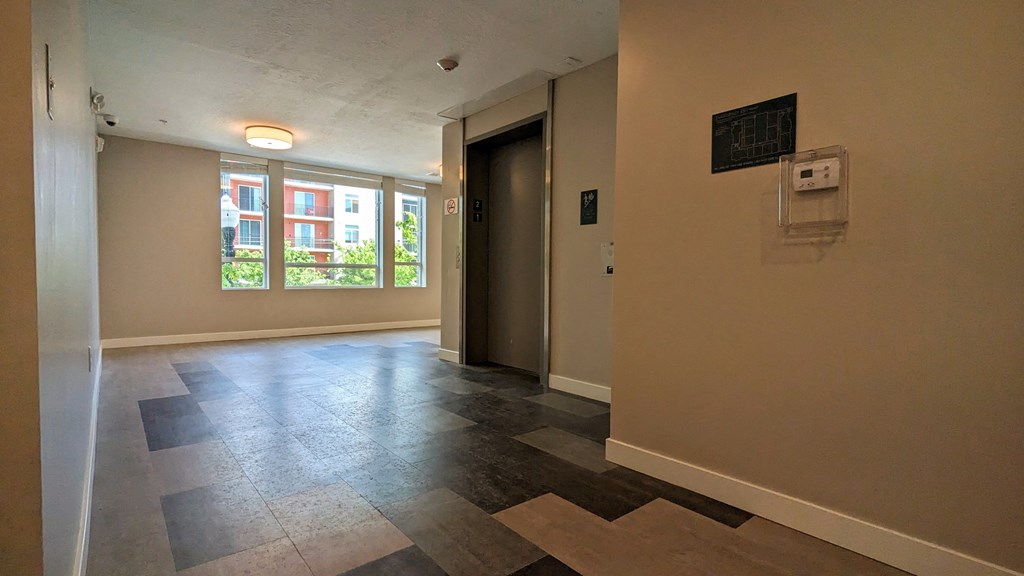 A large room with a large window and a door