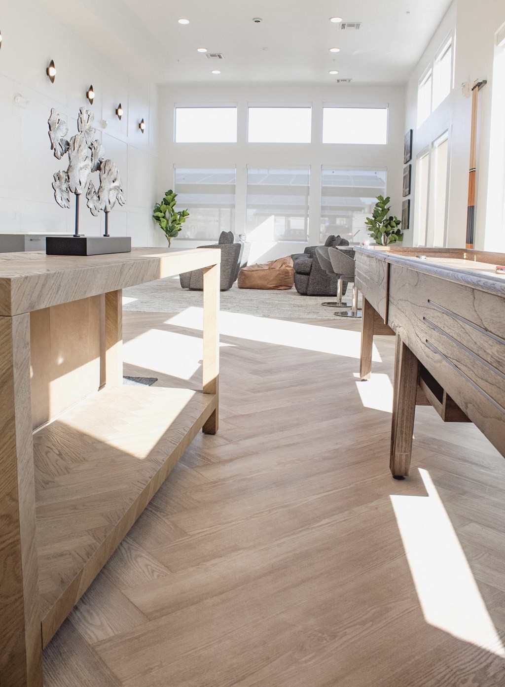 a living room with wooden floors and furniture