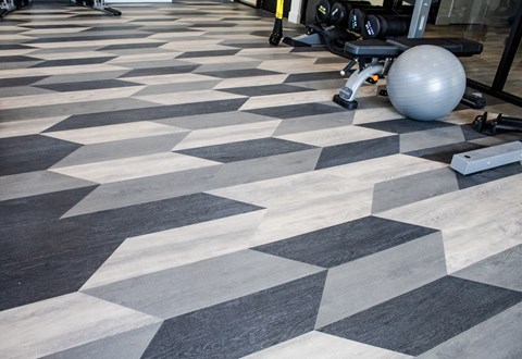 A gym with a black and white checkered floor