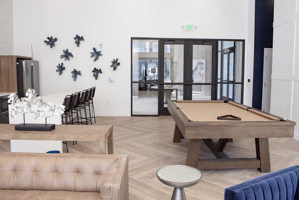 A living room with a pool table