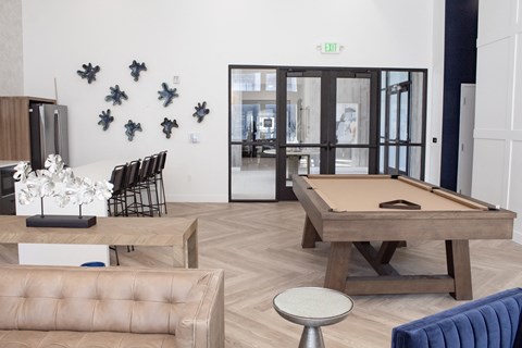 A living room with a pool table
