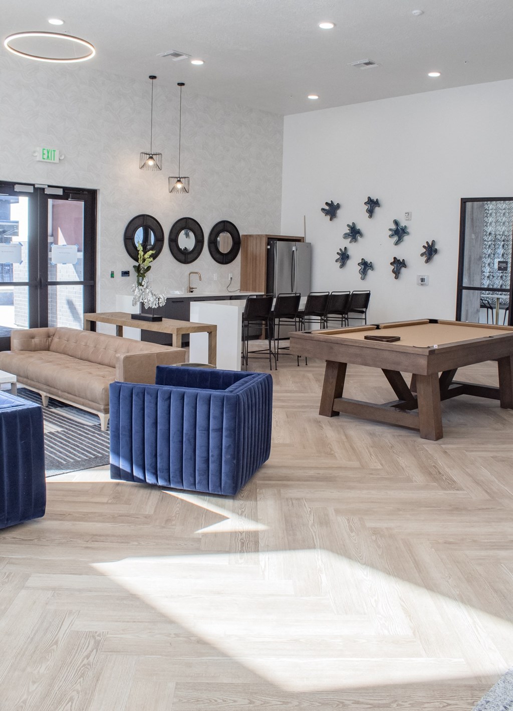 A living room with a pool table and couches