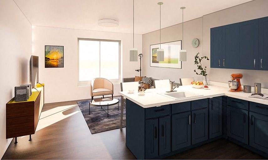 a kitchen and living room with a table and a sink