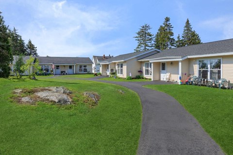 a group of houses on the side of a road