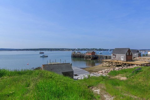 a view of a harbor with a dock and a boat in the water
