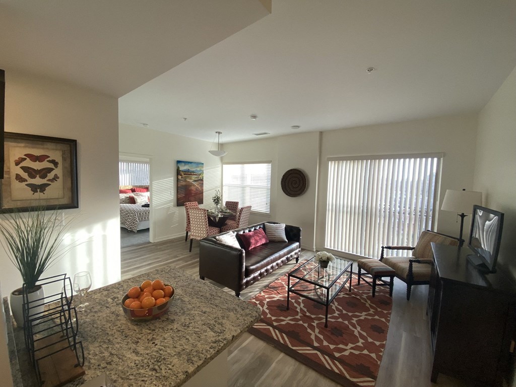 a view of the living room and dining room from the kitchen
