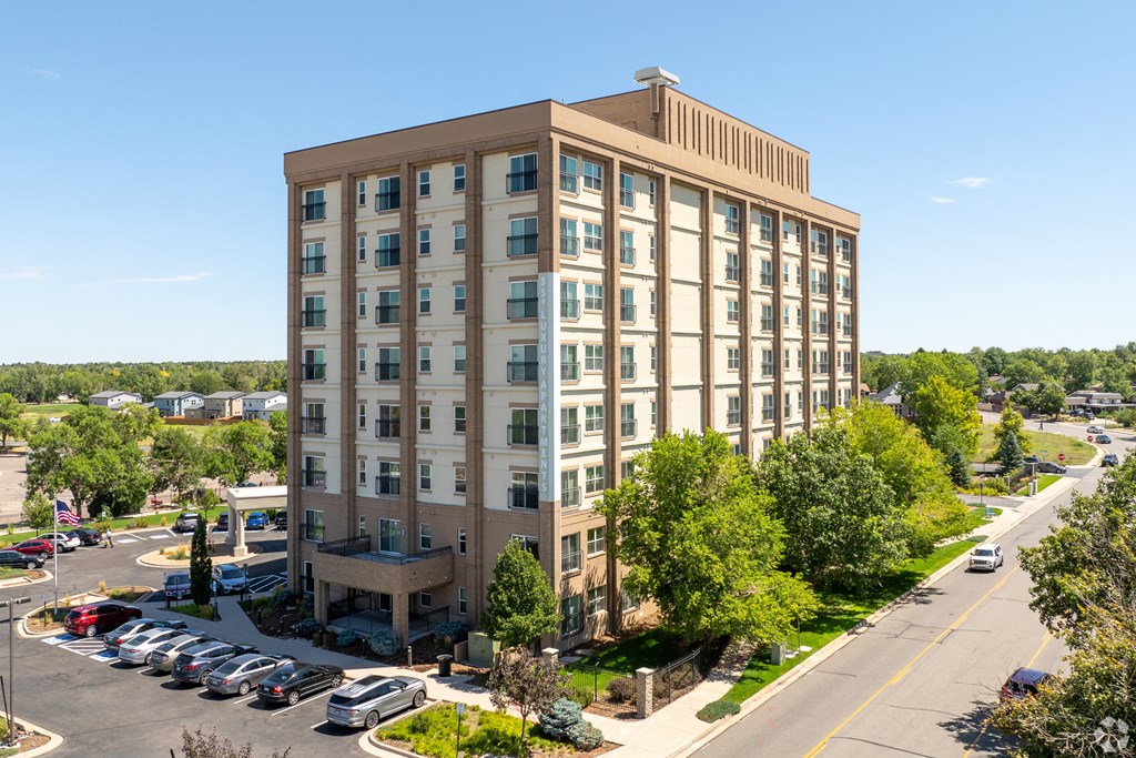 aerial view of apartment building and parking lot