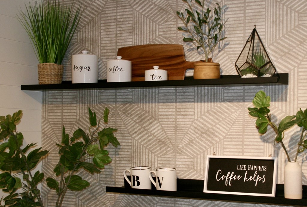 a shelf with plants and coffee cups and a sign that reads coffee labels