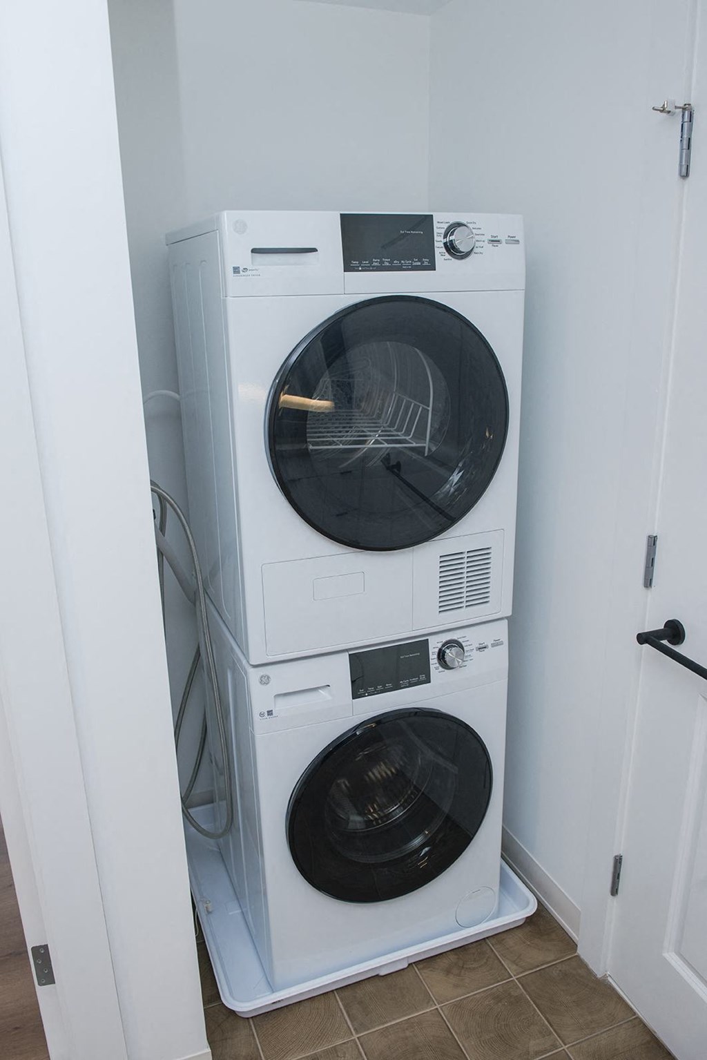 a washing machine and dryer in a small room
