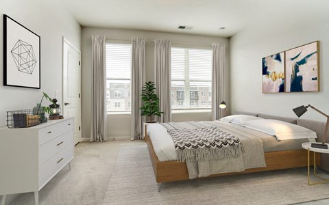 a bedroom with a bed and two windows
