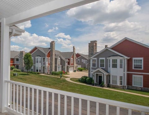 a view of a row of houses from a porch