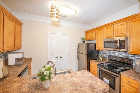 a kitchen with stainless steel appliances and a counter top