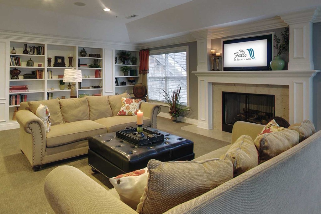 a living room filled with furniture and a fire place