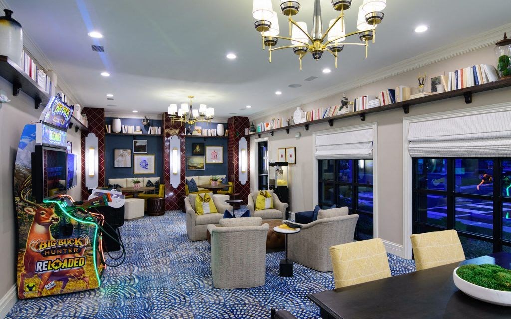 a living room filled with furniture and a video game