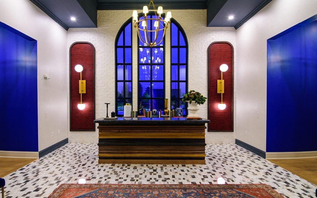 a view of a church with a large stained glass window