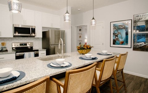 a kitchen with a marble counter top