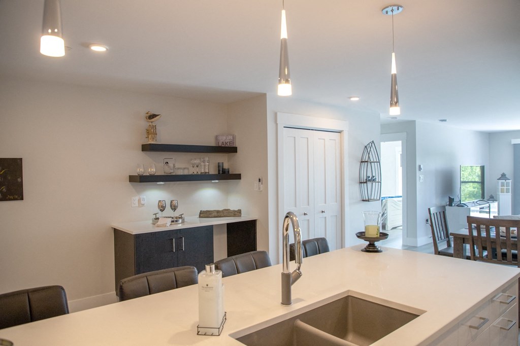 a kitchen with a sink and a counter top in a house