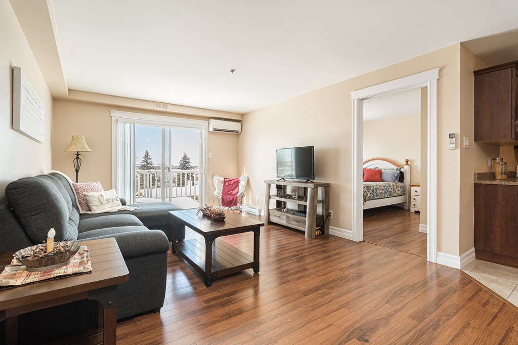 a living room with a couch and a coffee table and a tv