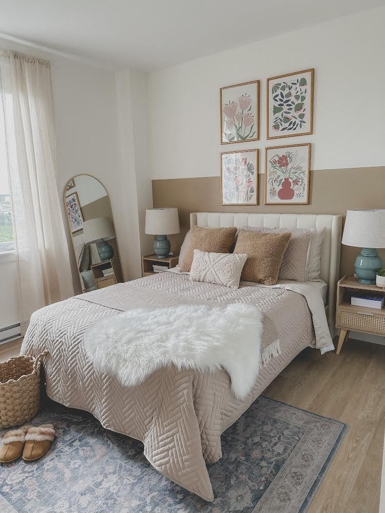 a bedroom with a bed and pictures on the wall