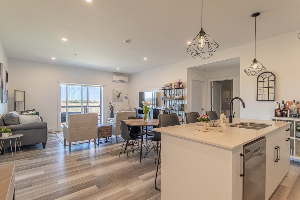 an open floor plan with a kitchen and living room